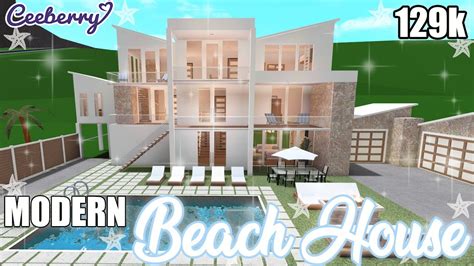 The whole city is surrounded by a rock border and splits at the river that flows into a larger body of water. . Beach modern house bloxburg